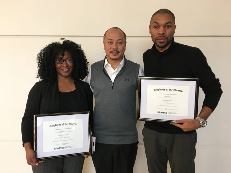 Employees of the Quarter, Sheila Roberts (left) and Jamal Young (right) with Howie Huang (center), Vice President for Sparks Group 