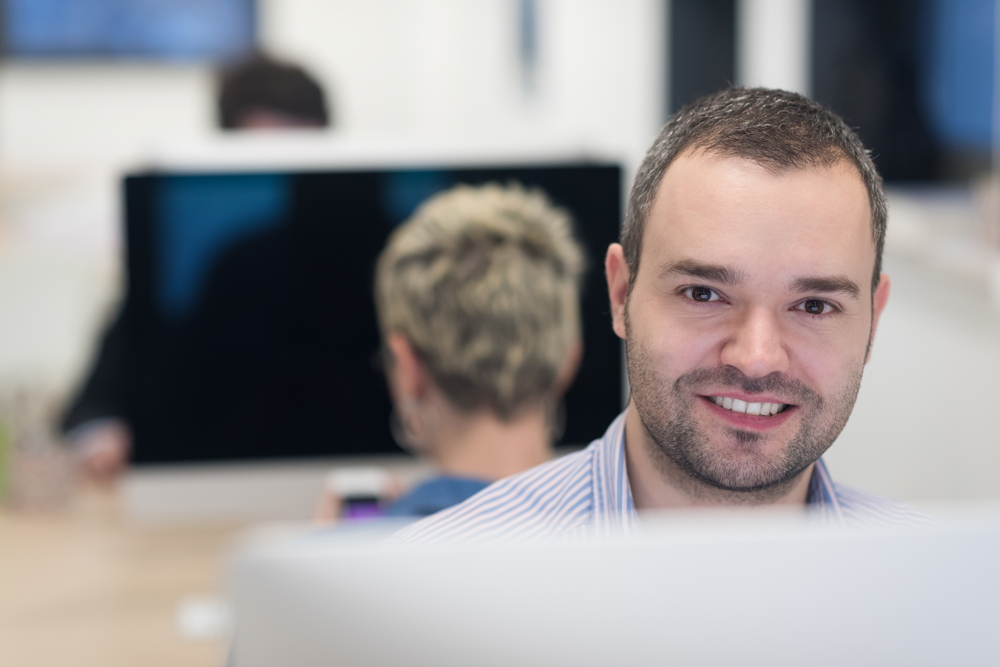 startup business, software developer working on desktop computer at modern office