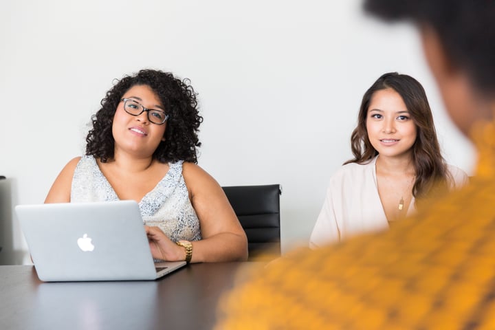 coworkers on a laptop