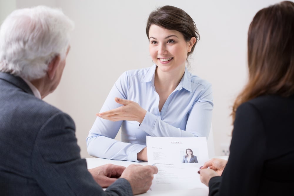 Human resources team during job interview with woman.jpeg